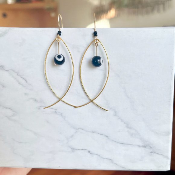 Gold Fish Earrings with Black Evil Eye Worry Bead - Picture 4 of 4